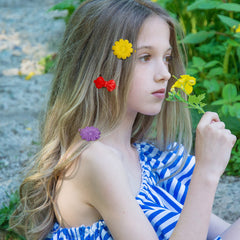 Janinka barrettes clipped in toddler hair for tidy, cute look
