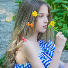 Janinka close-up of cartoon-shaped barrettes, charming accents to personalize hair