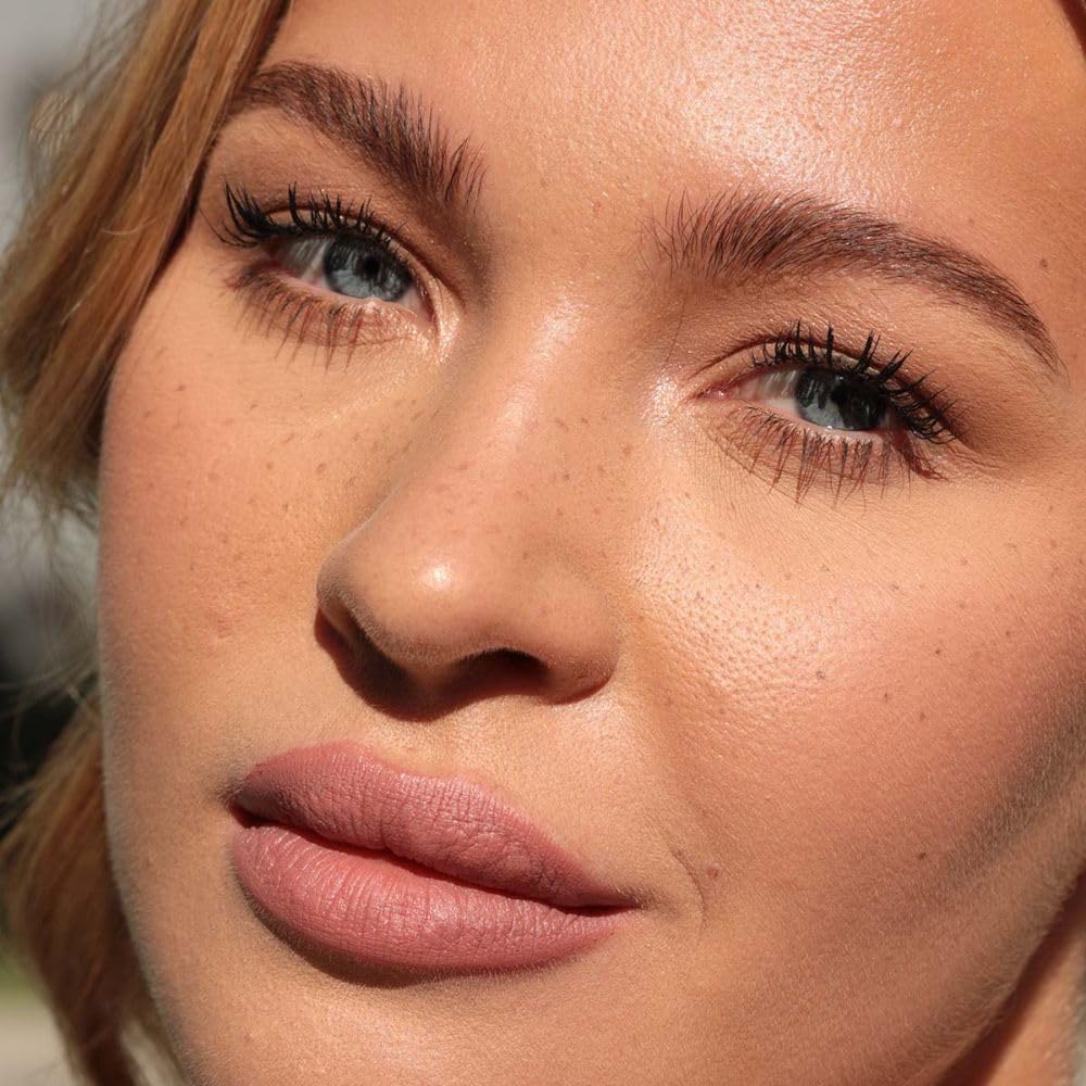 Jason Wu swatched freckle dots on skin demonstrating natural, sun-kissed finish