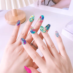 Application photo with JERCLITY nail strip being smoothed onto fingernail for fast manicure