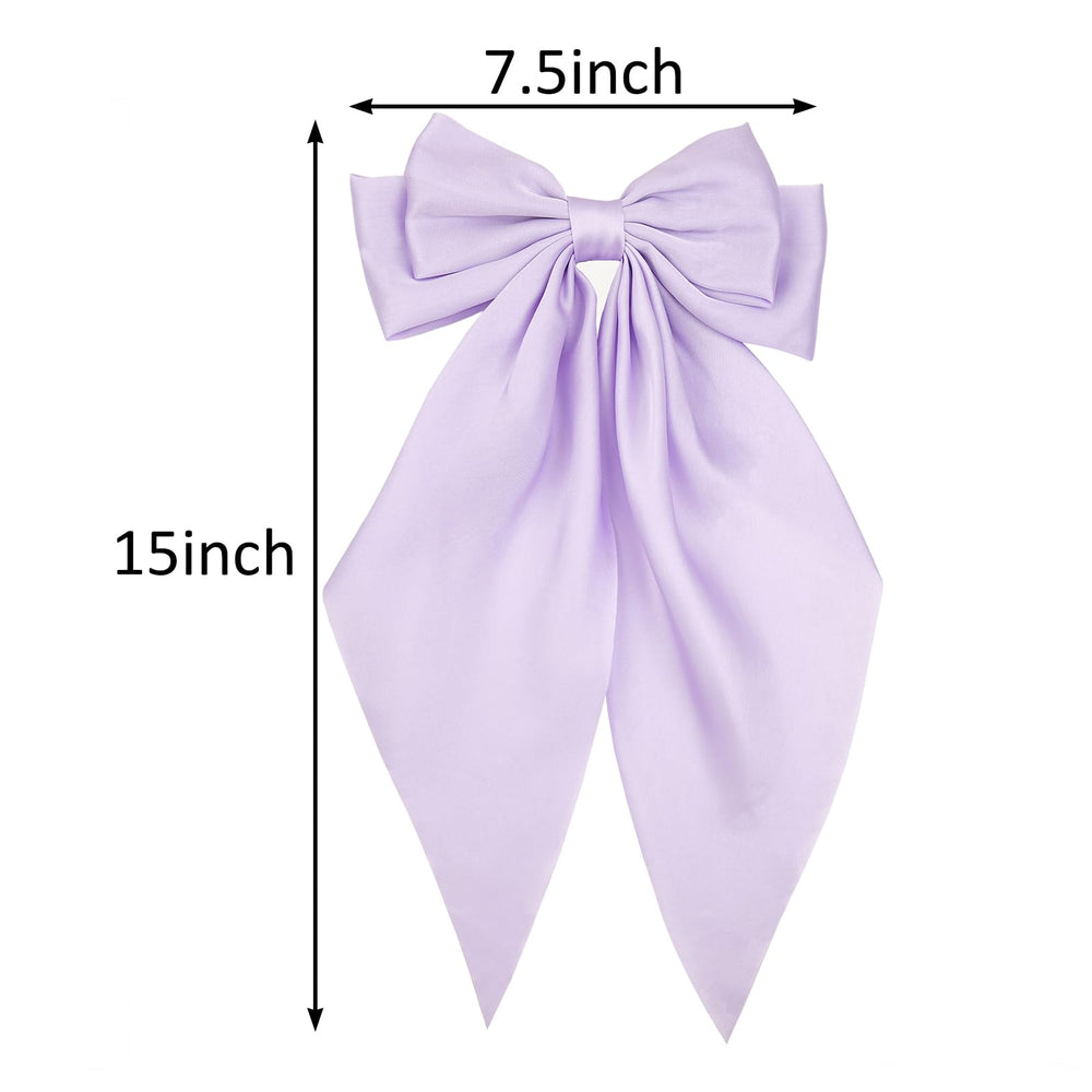 JGQUR bow clipped to ponytail adding volume and feminine movement