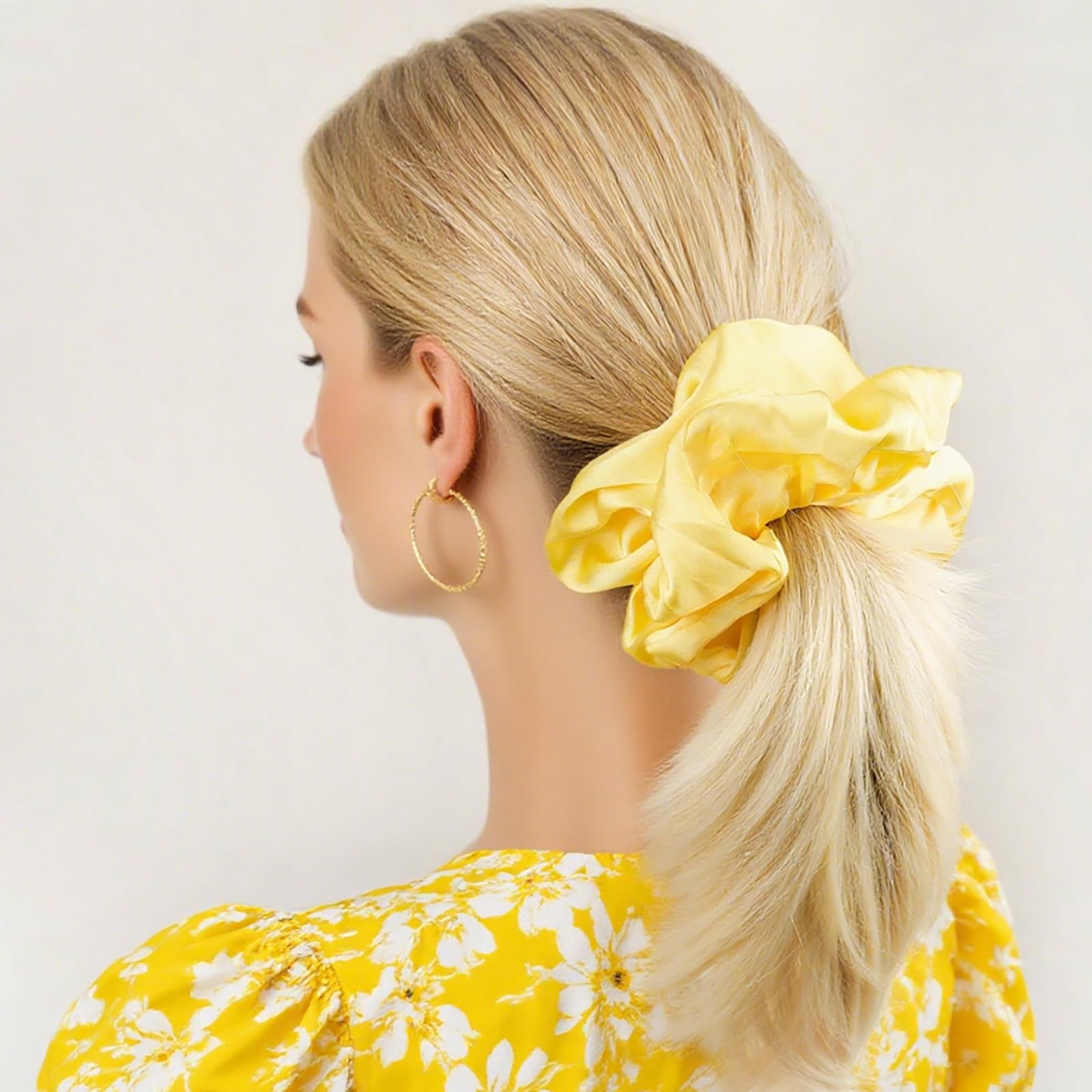 JGQUR scrunchie securing a high ponytail on thick curly hair for secure styling