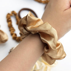 JGQUR scrunchie in ponytail demonstrating comfortable hold and minimal creasing