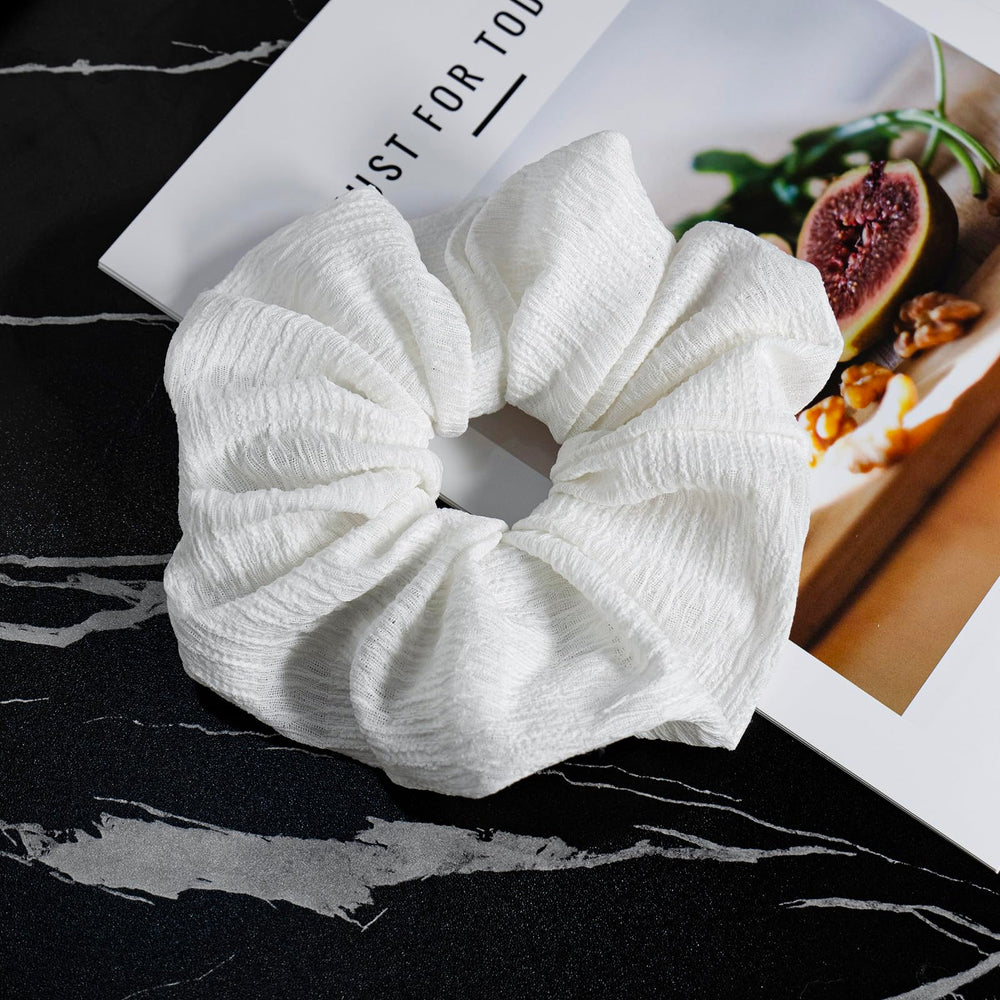 JGQUR scrunchie holding a messy bun without creases or pulling