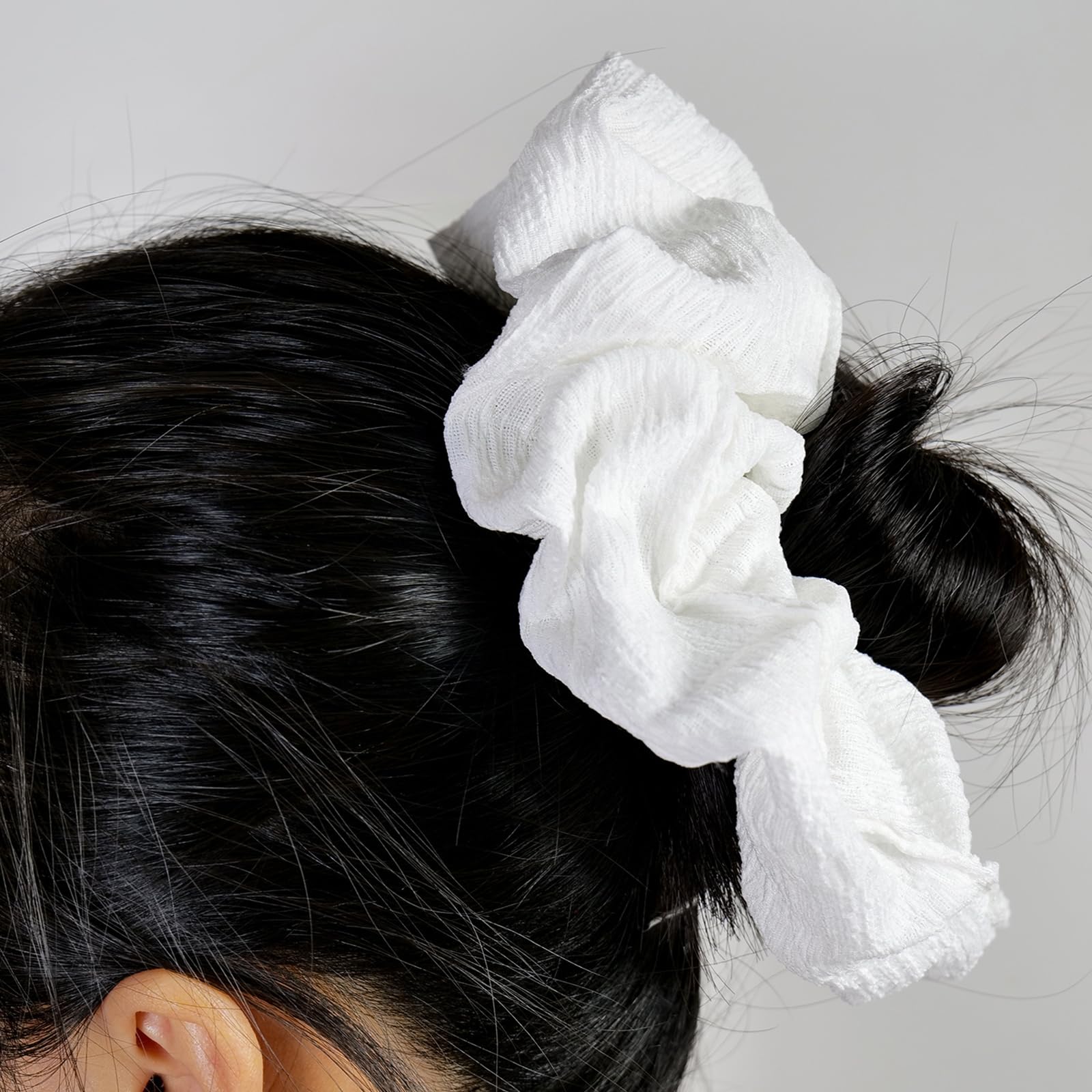 JGQUR scrunchie worn on wrist as accessory and easy storage