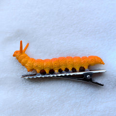 JINBUYAO clip held in hand for scale showing compact size and lightweight comfort