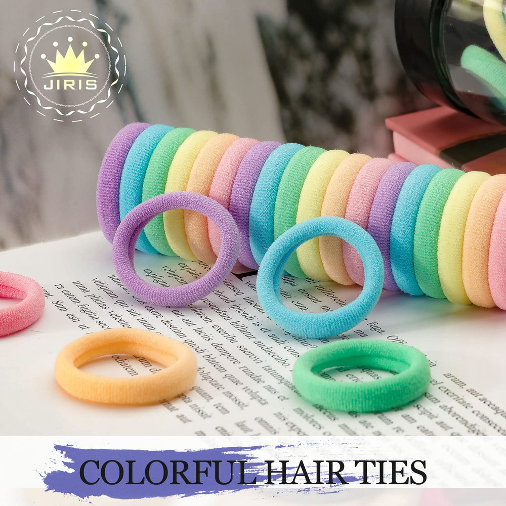 JIRIS hair ties next to a hand showing scale and usable quantity