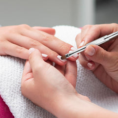 JJUNW liner tip drawing a French smile line for precise nail art