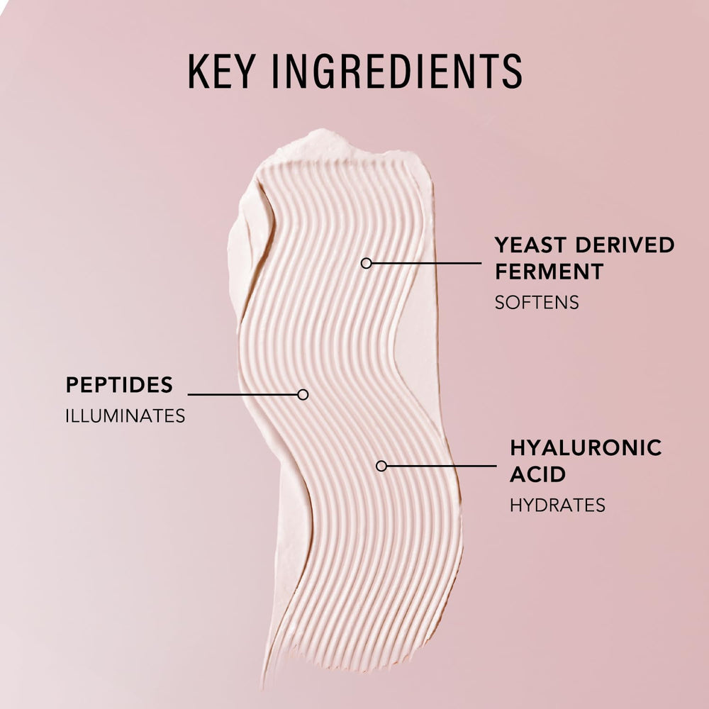 JLO BEAUTY next to a lipstick to show jar scale and travel-friendly size benefit
