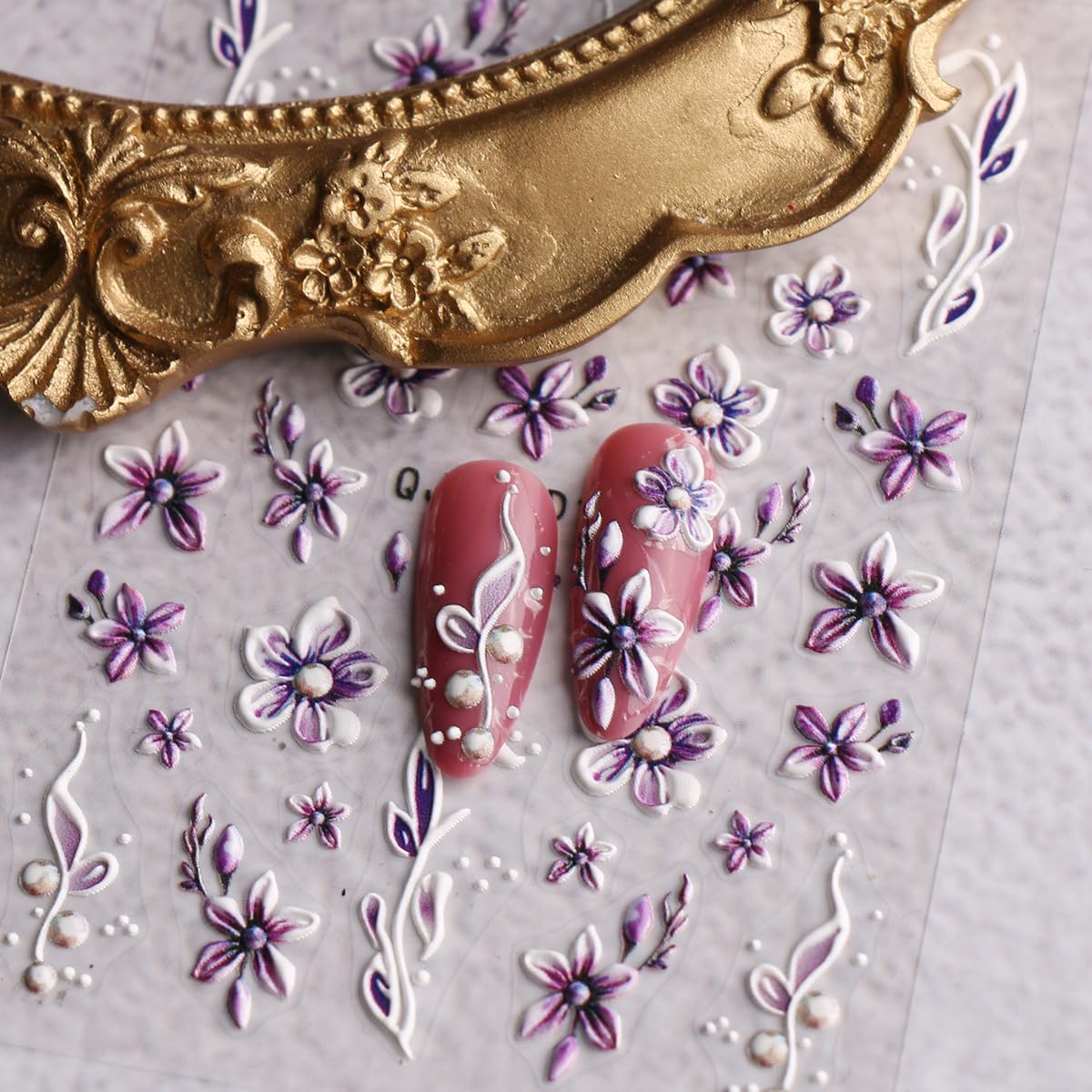 jmeowio lifestyle hands with flowers showing finished manicure for seasonal styling