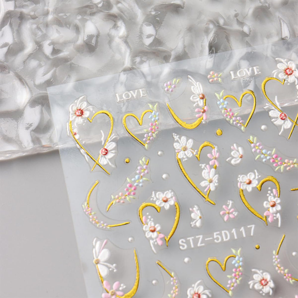 jmeowio lifestyle handshot of manicured hand modeling floral stickers for style inspiration