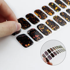 jmeowio applied on nails showing purple red black design and long-lasting glossy benefit