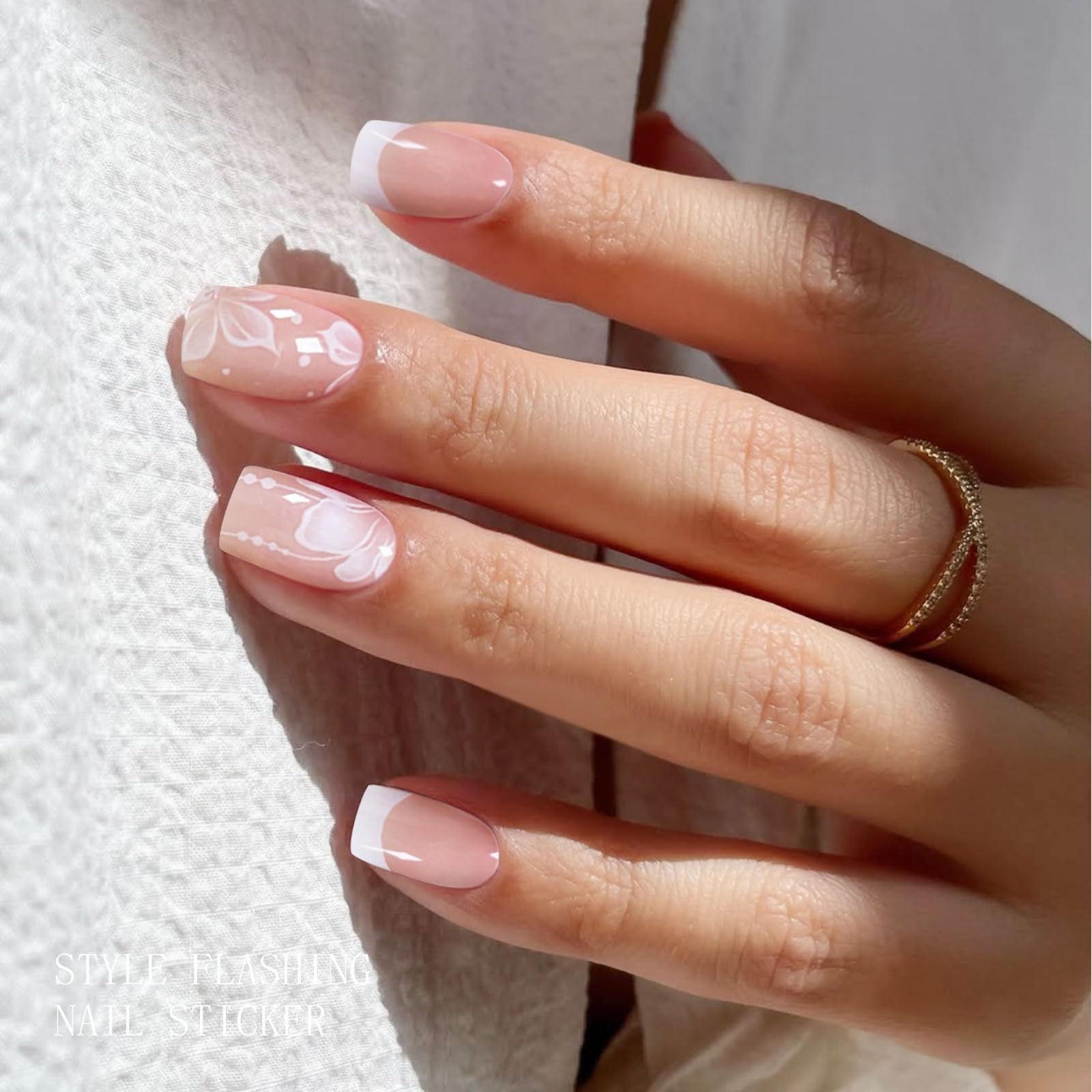 jmeowio detailed white flower pattern on nail strip highlighting delicate decoration