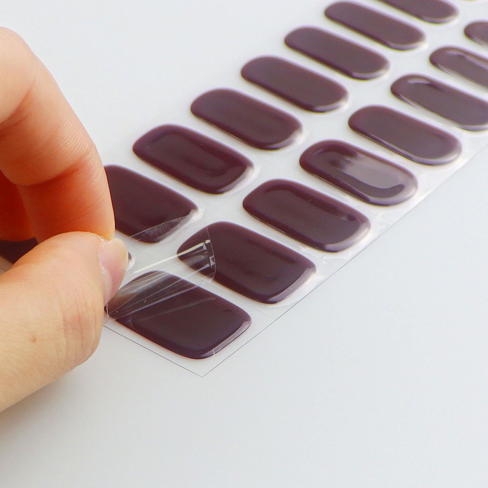 jmeowio wine red strips applied on natural nails for salon-style look