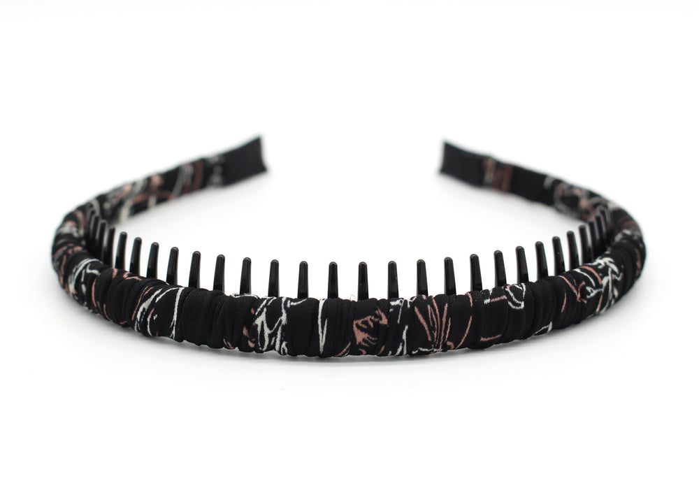 JOBAND headband in hand to show scale and lightweight wearability benefit