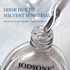JODSONE being applied over uncured base gel to create flowing wave patterns