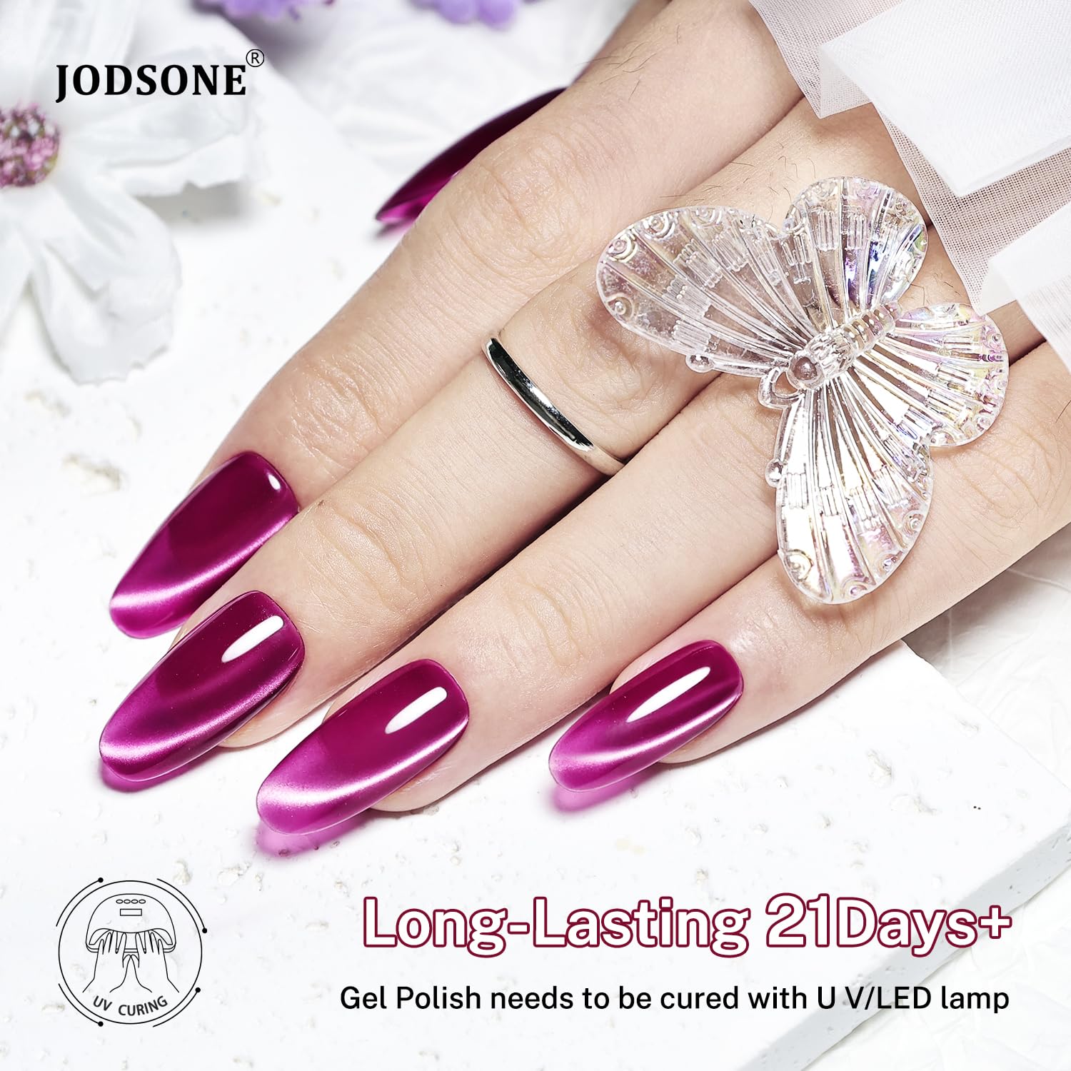 JODSONE magnet held above wet gel creating a clear cat-eye stripe benefit