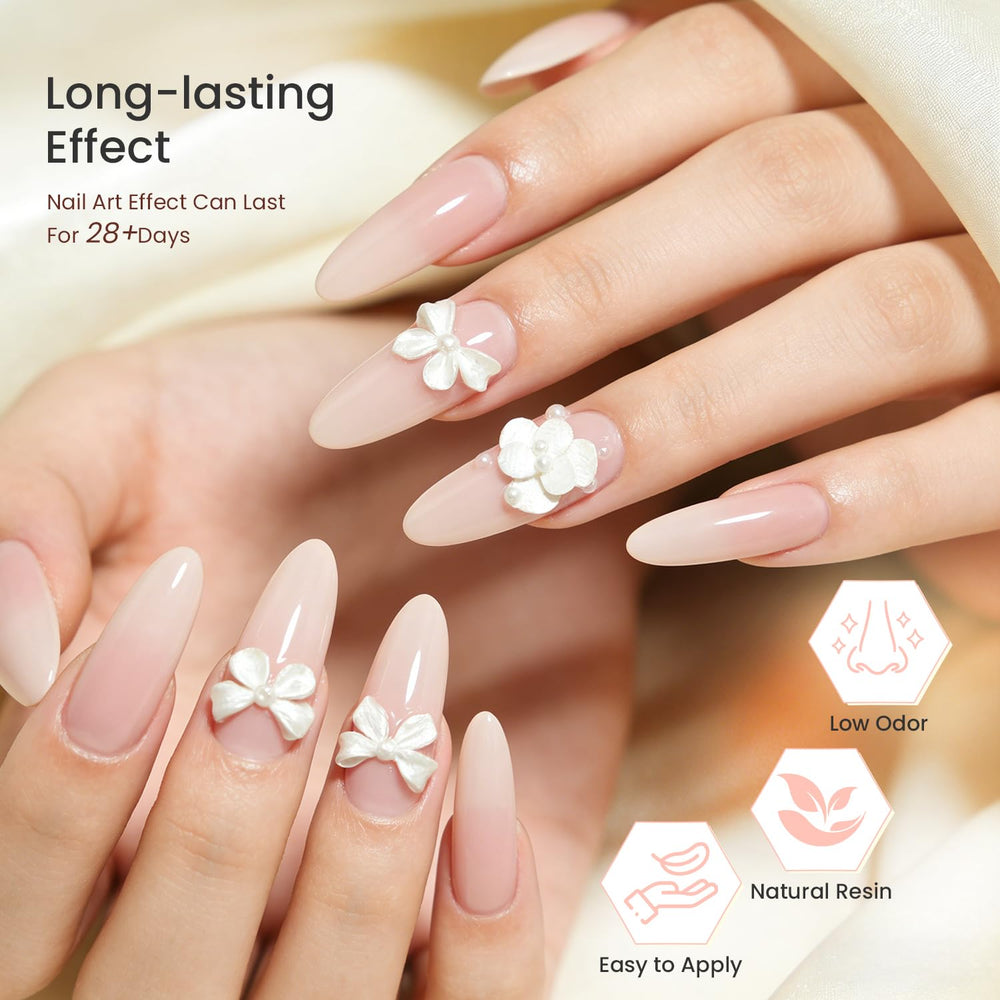 JODSONE finished manicure on hand showcasing elegant pearl white 3D design