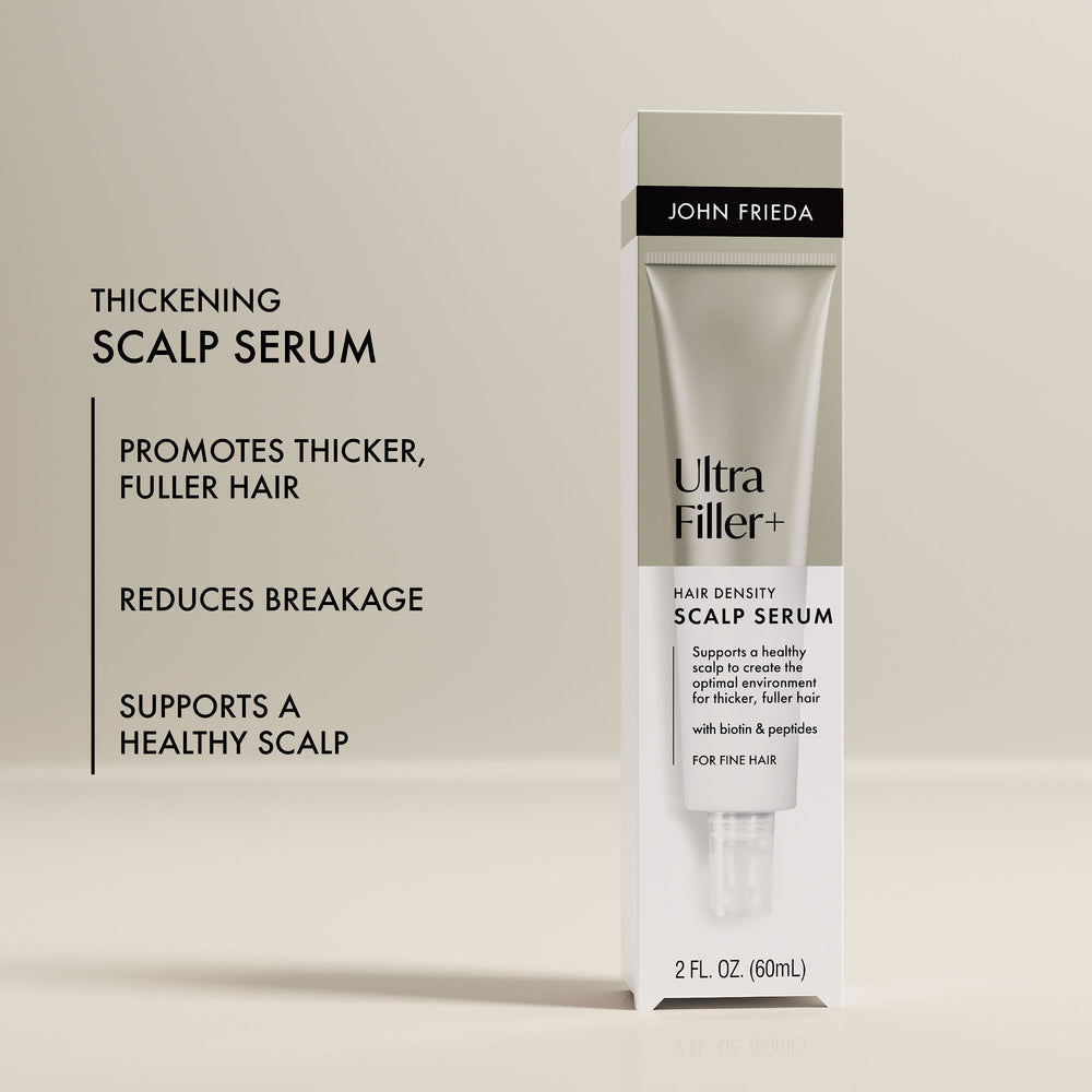 John Frieda applying serum to scalp targeting roots for strengthened hair
