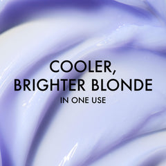 John Frieda bottle label highlighting 50% recycled material and eco benefit