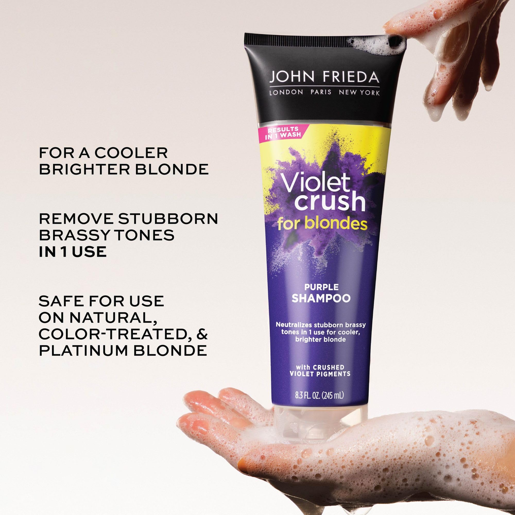 Pouring John Frieda purple shampoo to show crushed violet pigment texture and control