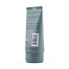 JOHNNY B. control 3.3 oz size comparison next to a comb to illustrate travel-friendly volume and convenience