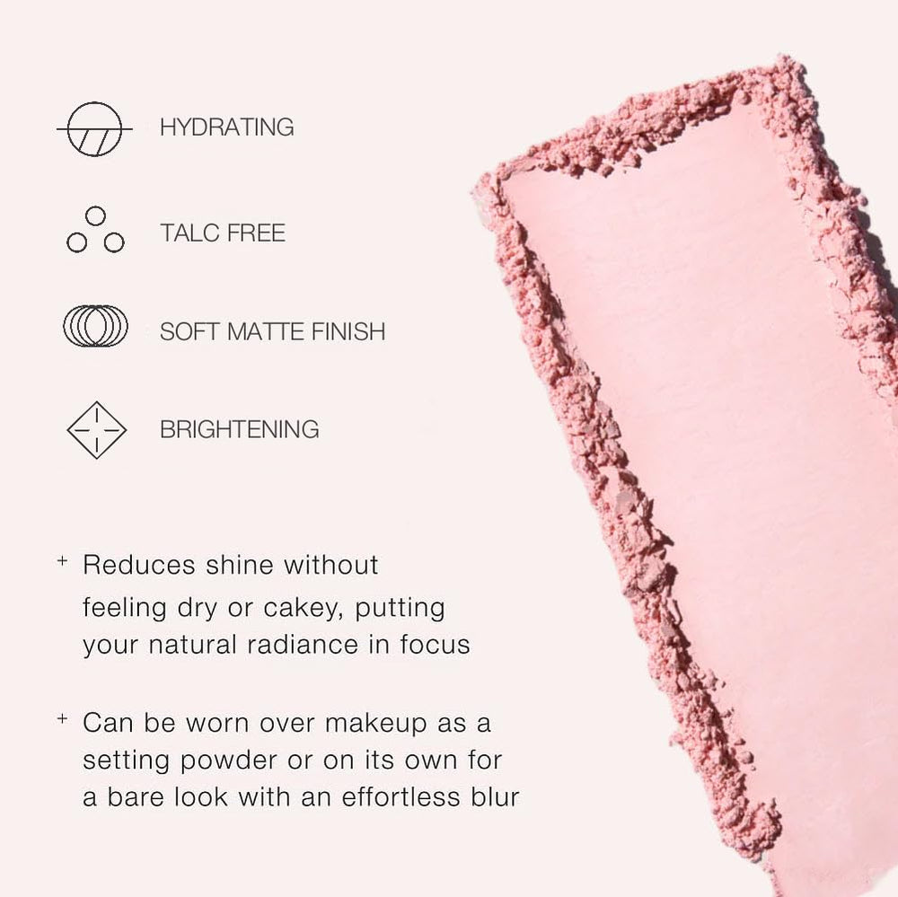 Jouer powder being picked up with brush demonstrating easy application and light coverage benefit