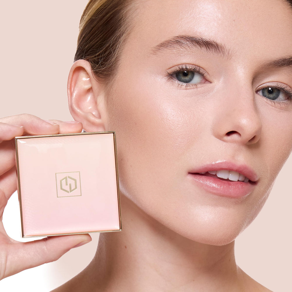 Flatlay of Jouer powder with hyaluronic and green tea elements highlighting skin-supporting benefits