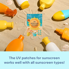 Joyful Artistry family at beach using stickers to monitor sunscreen protection