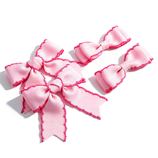 JOYFUNFABU front view of four pink bows showing sizes and packaging, adds instant outfit charm