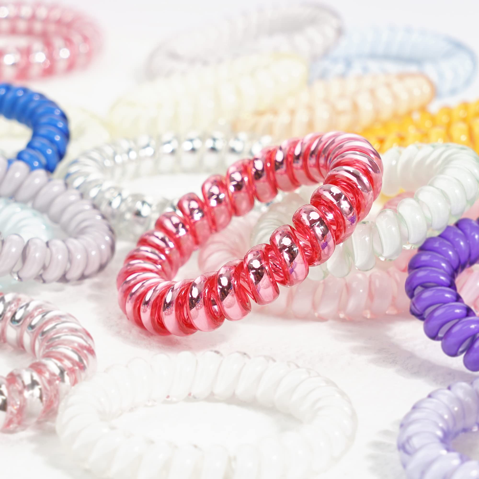 JOYOYO close-up of spiral coil texture, smooth finish prevents hair damage