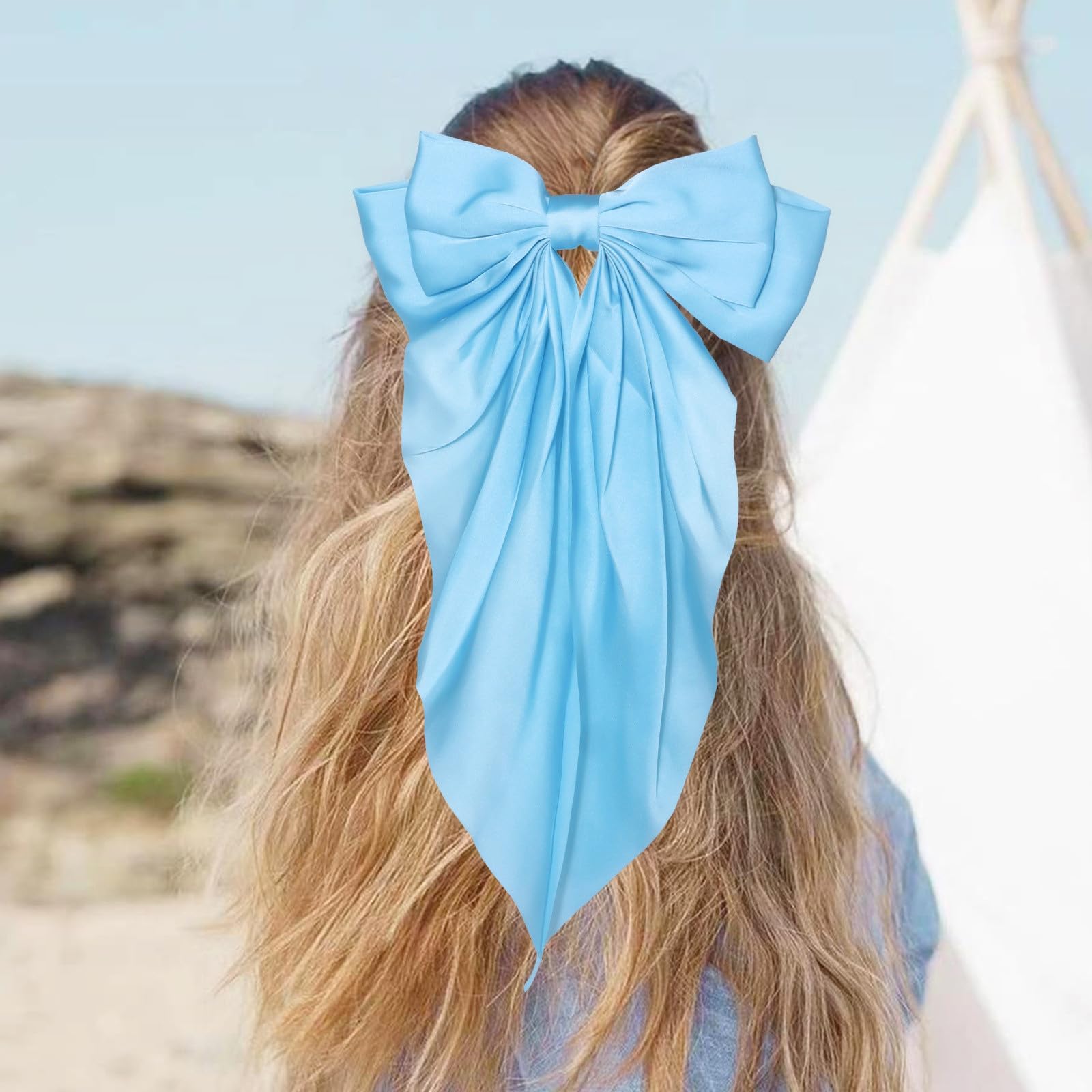 JOYRUBY bow held in hand to show scale and size for styling