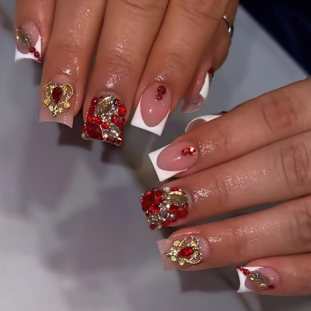 Jremg front packaging showing glossy white French tips and red rhinestone accents for instant glam
