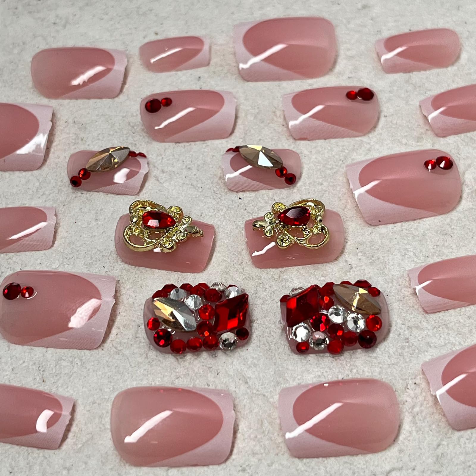 Jremg nails held in hand to show short square length and real-life size comparison