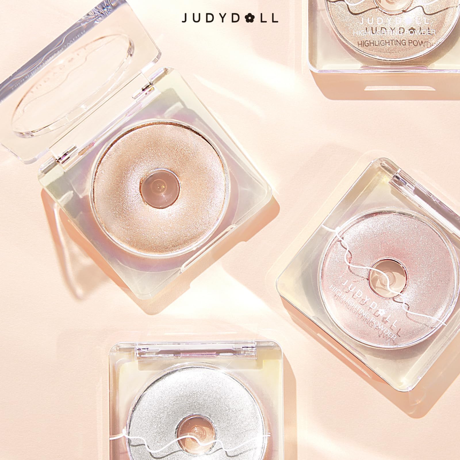 JUDYDOLL compact next to coin showing size and portable travel-friendly benefit