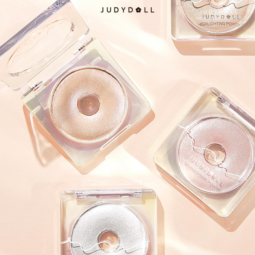 JUDYDOLL compact next to coin showing size and portable travel-friendly benefit