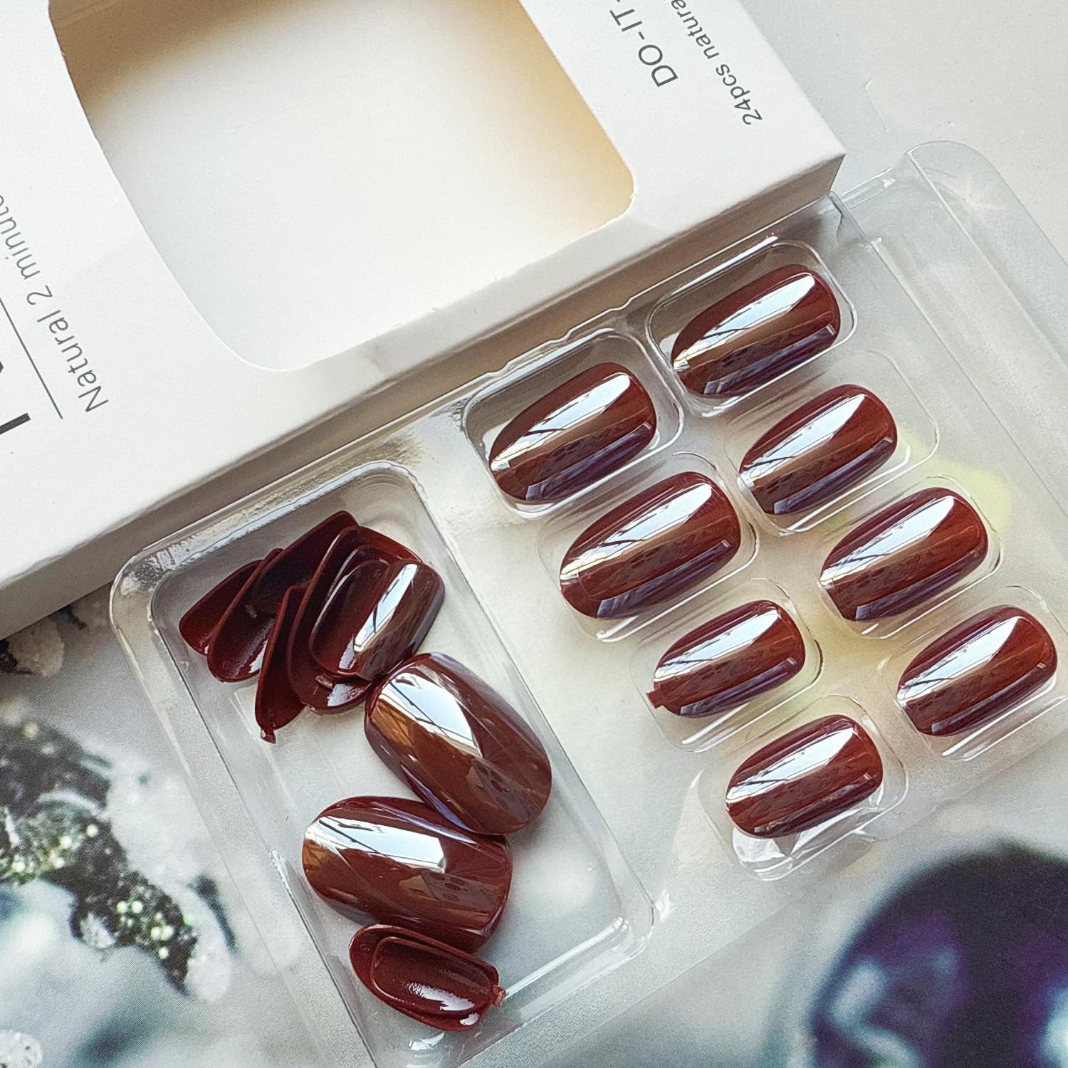 juggssa press-on nails worn on a hand model demonstrating natural, elegant effect