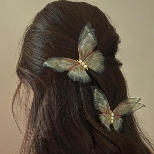 Jumwrit front view of two green butterfly clips showing decorative pearls and shape, elegant accent