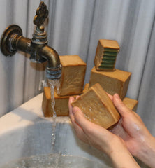JUSIZA wrapped bars presented as gift-ready natural soap