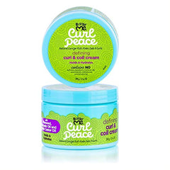 Child applying Just For Me cream to damp curls demonstrating gentle detangling