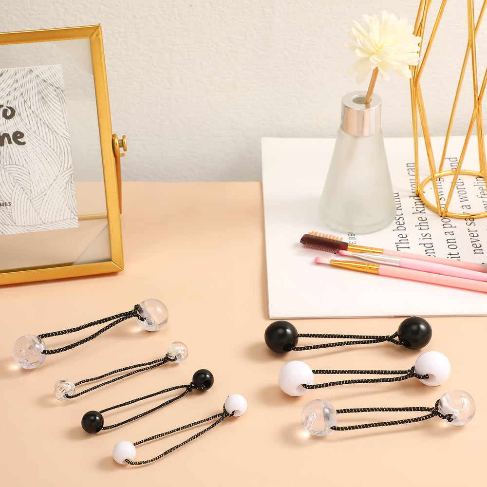 Jutom hair tie next to coin scale showing 20mm compact size benefit