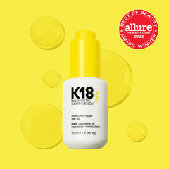 K18 oil texture on fingertips illustrating lightweight, quick-absorbing formula benefits