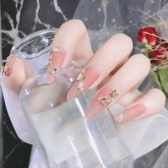 KACHIMOO styled manicure scene showing finished nails with metallic butterflies