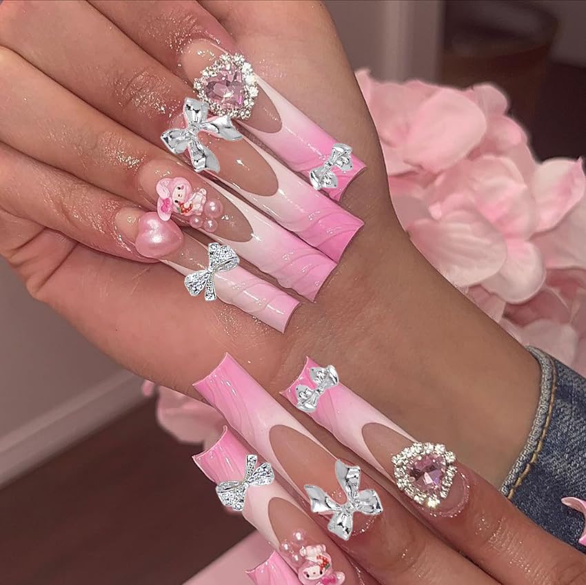 KACHIMOO bow charm applied on a finished manicure showcasing elegance