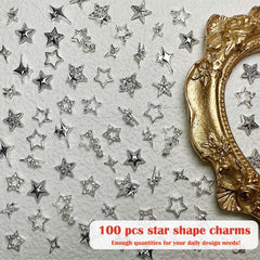 KACHIMOO star charms in a manicure scene showcasing finished nail design