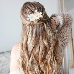 KALIONE hairpins worn in a bridal updo adding romantic accents