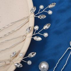 KALOLIA hand holding pins showing scale and lightweight benefit