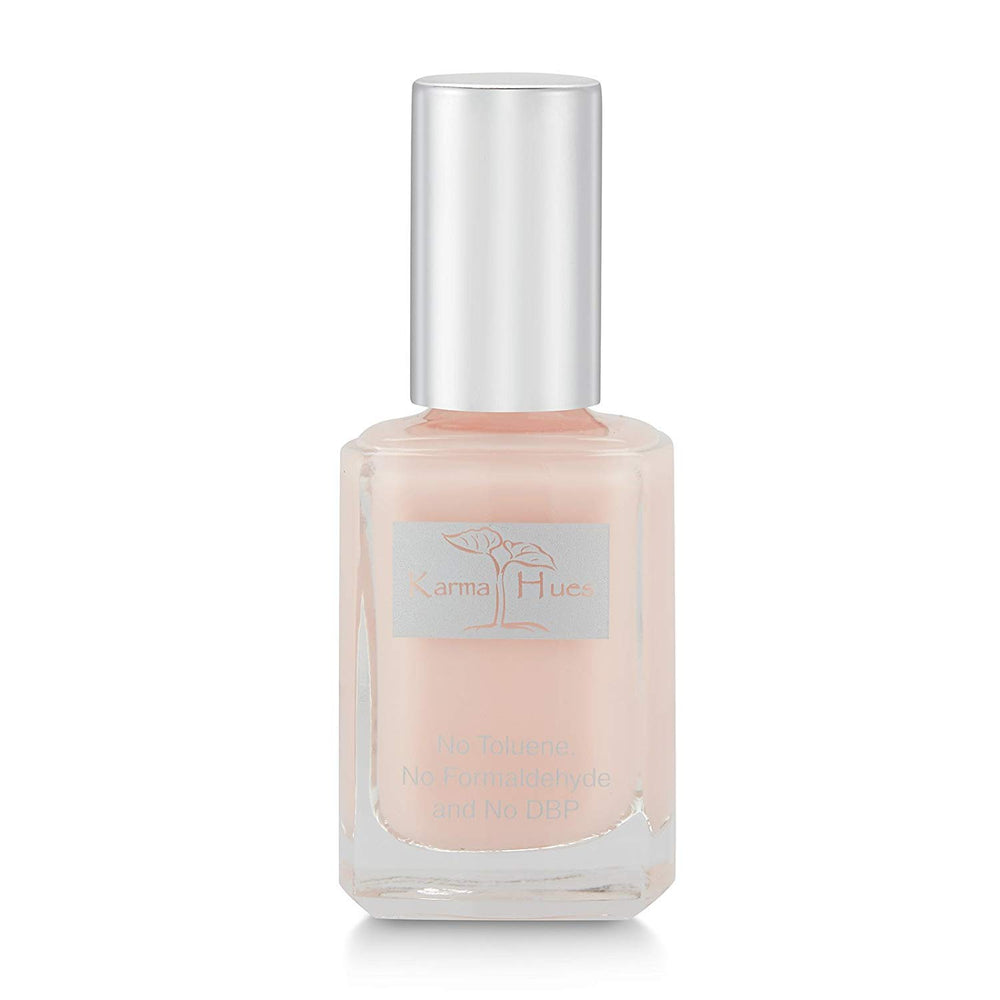karma organic front bottle showing glossy pink shade and clean packaging benefit