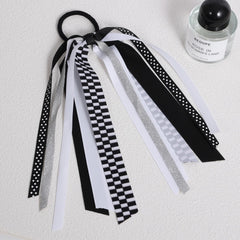 KCHIES close-up of glitter checkered bow highlighting durable decorative finish