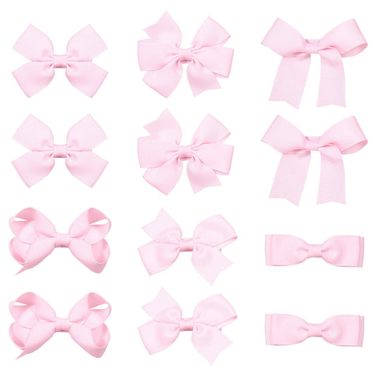 KCHIES front packaging showing 12 pink bows, clear set presentation and gift-ready benefit